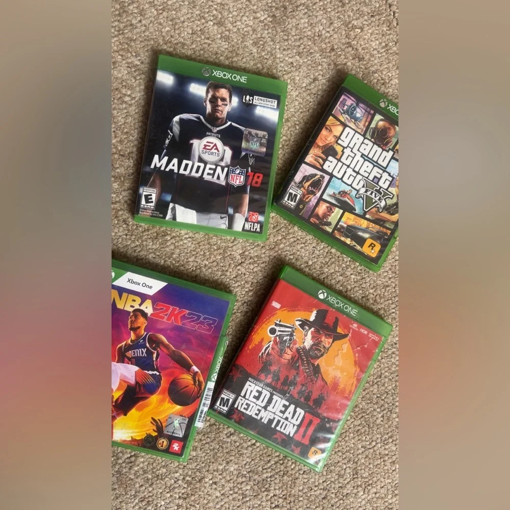 Xbox console with four games and controller included